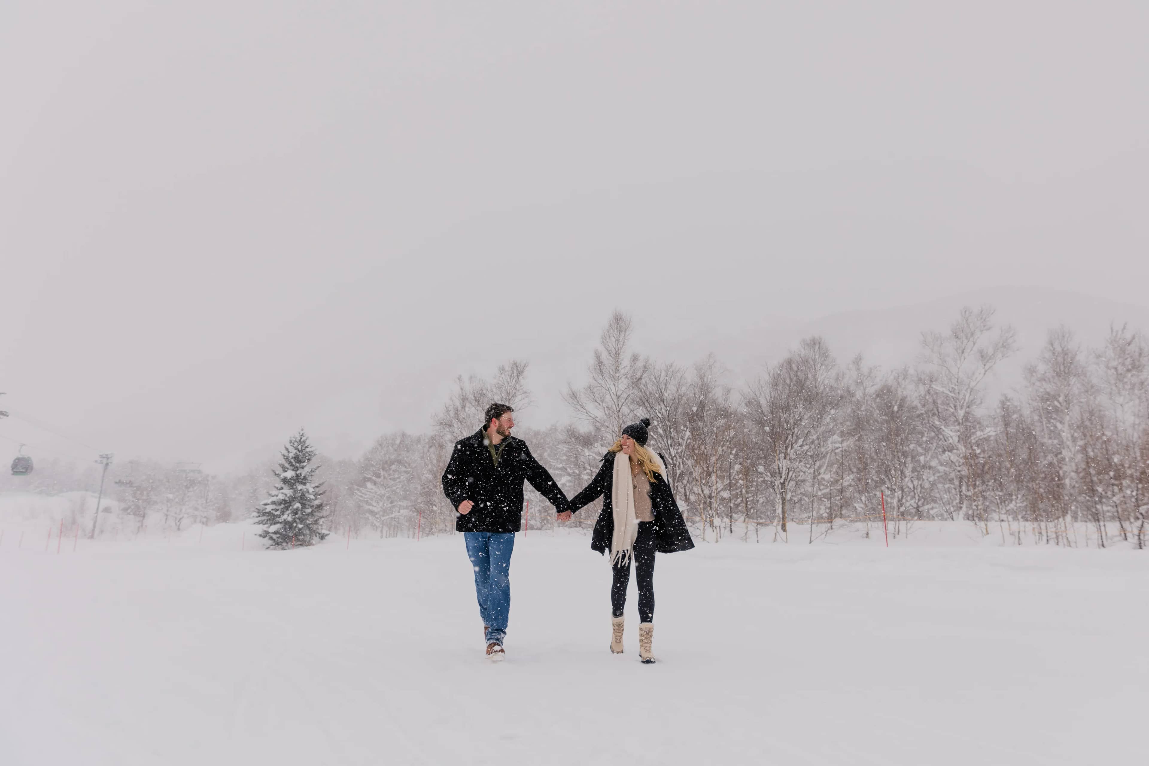 Couple in Niseko snow landscape 1