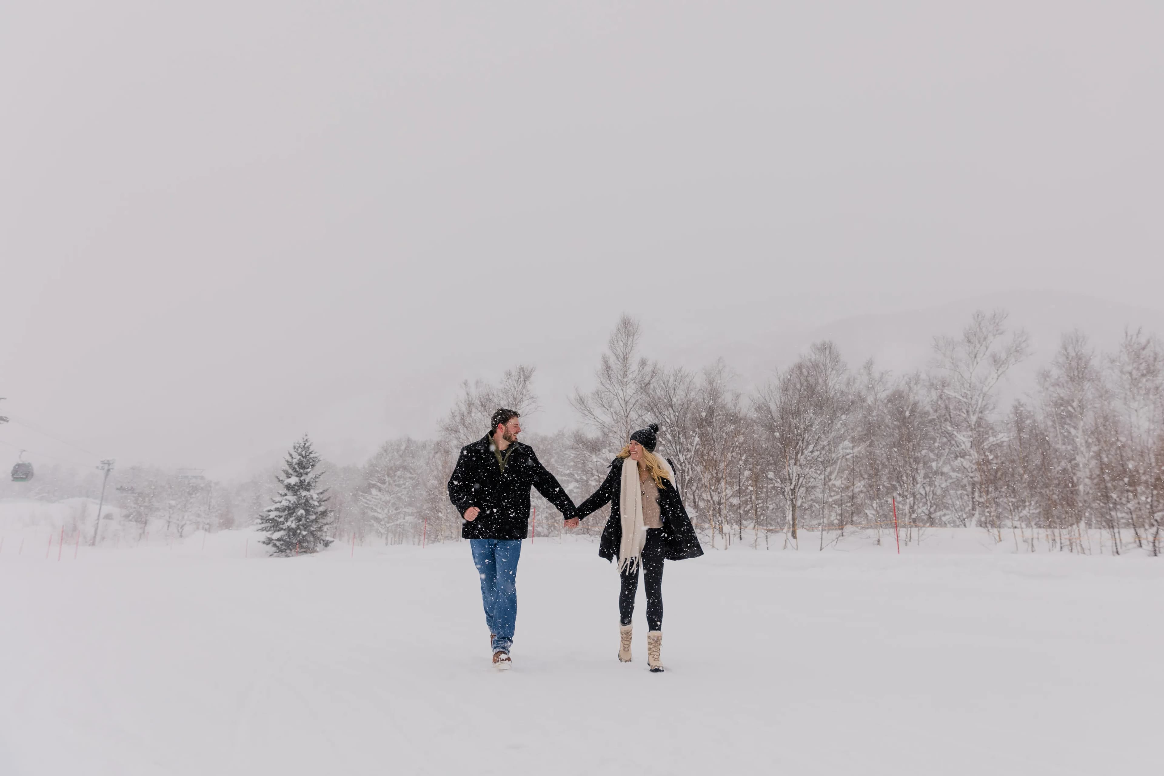 Couple in Niseko snow landscape 1